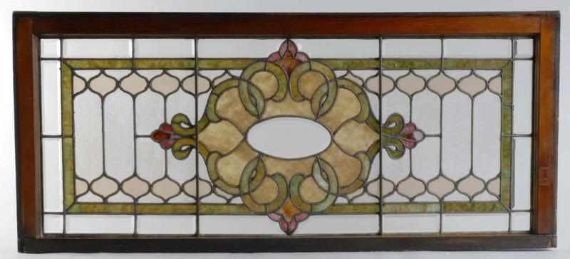 Appraisal: Stained Leaded Glass Window Description In wooden frame With geometric