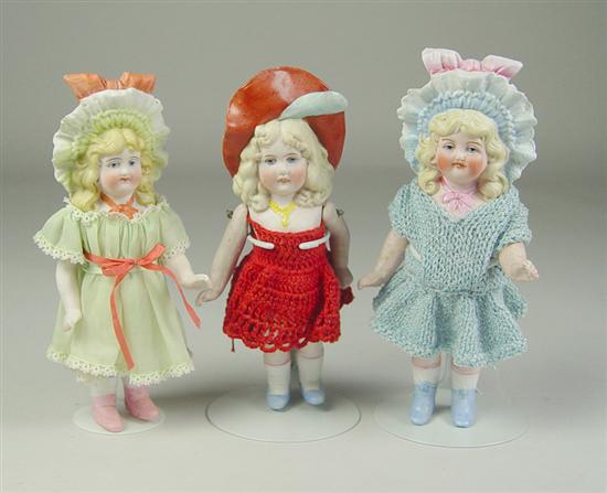 Appraisal: Three German All-Bisque Bonnet Girls Blue painted eyes single stroke