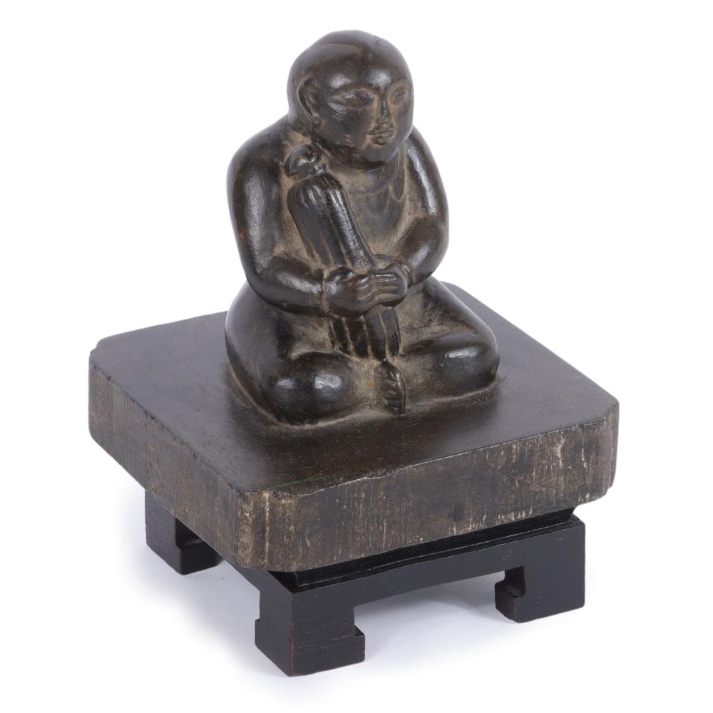 Appraisal: SINO-TIBETAN CHINESE BLACK HARDSTONE CARVING OF A SEATED BUDDHIST MONK