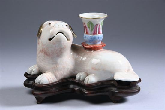 Appraisal: CHINESE FAMILLE ROSE PORCELAIN FU LION-FORM CANDLE HOLDER Qing Dynasty