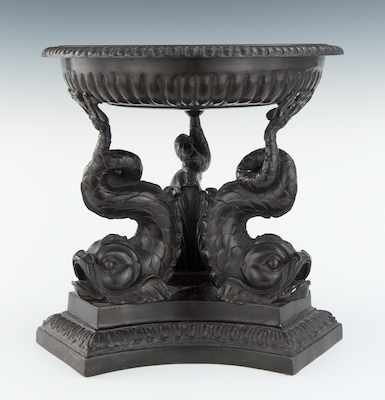 Appraisal: A Tripod Bronze Brazier with Dolphin Supports The circular dish