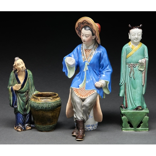 Appraisal: A Chinese porcelain figure of an immortal in green aubergine