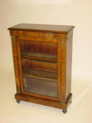 Appraisal: A VICTORIAN WALNUT PIER DISPLAY CABINET of shallow oblong form