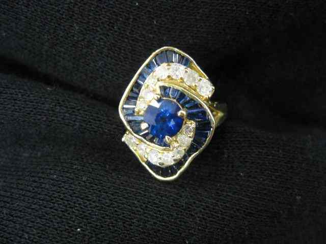 Appraisal: Sapphire Diamond Ring carat round gem surrounded by baguette sapphires