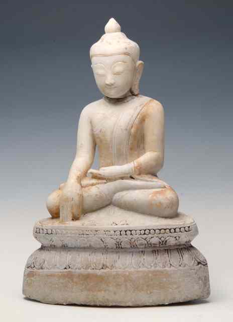 Appraisal: A BURMESE CARVED ALABASTER SEATED BUDDHA on a gilded and