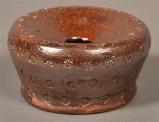 Appraisal: th Century Glazed Redware Ladies Cuspidor With stamped rosette decoration