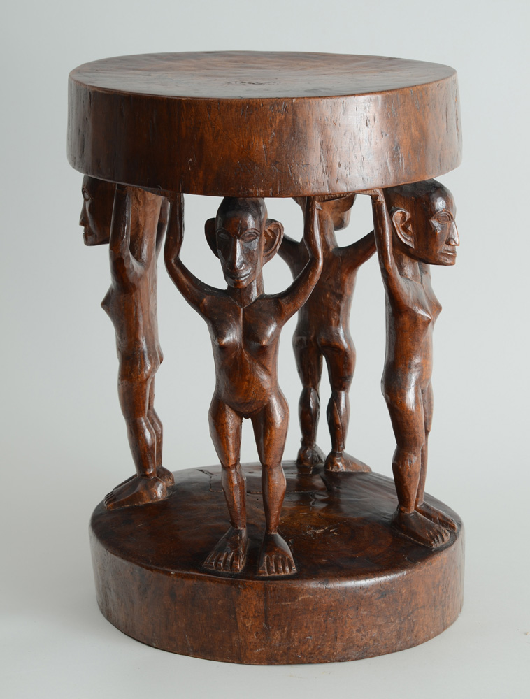 Appraisal: AFRICAN CARVED WOOD STOOL The circular seat on four standing