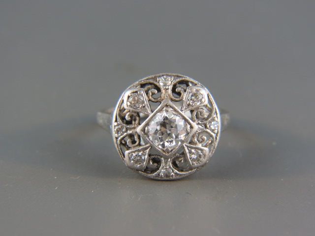 Appraisal: Platinum Diamond Ring carat reound diamond surrounded by round diamonds