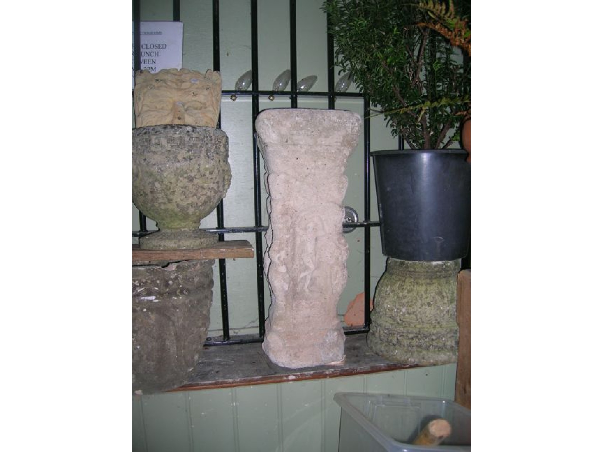 Appraisal: A weathered pedestal with relief classical alternating figure niches etc