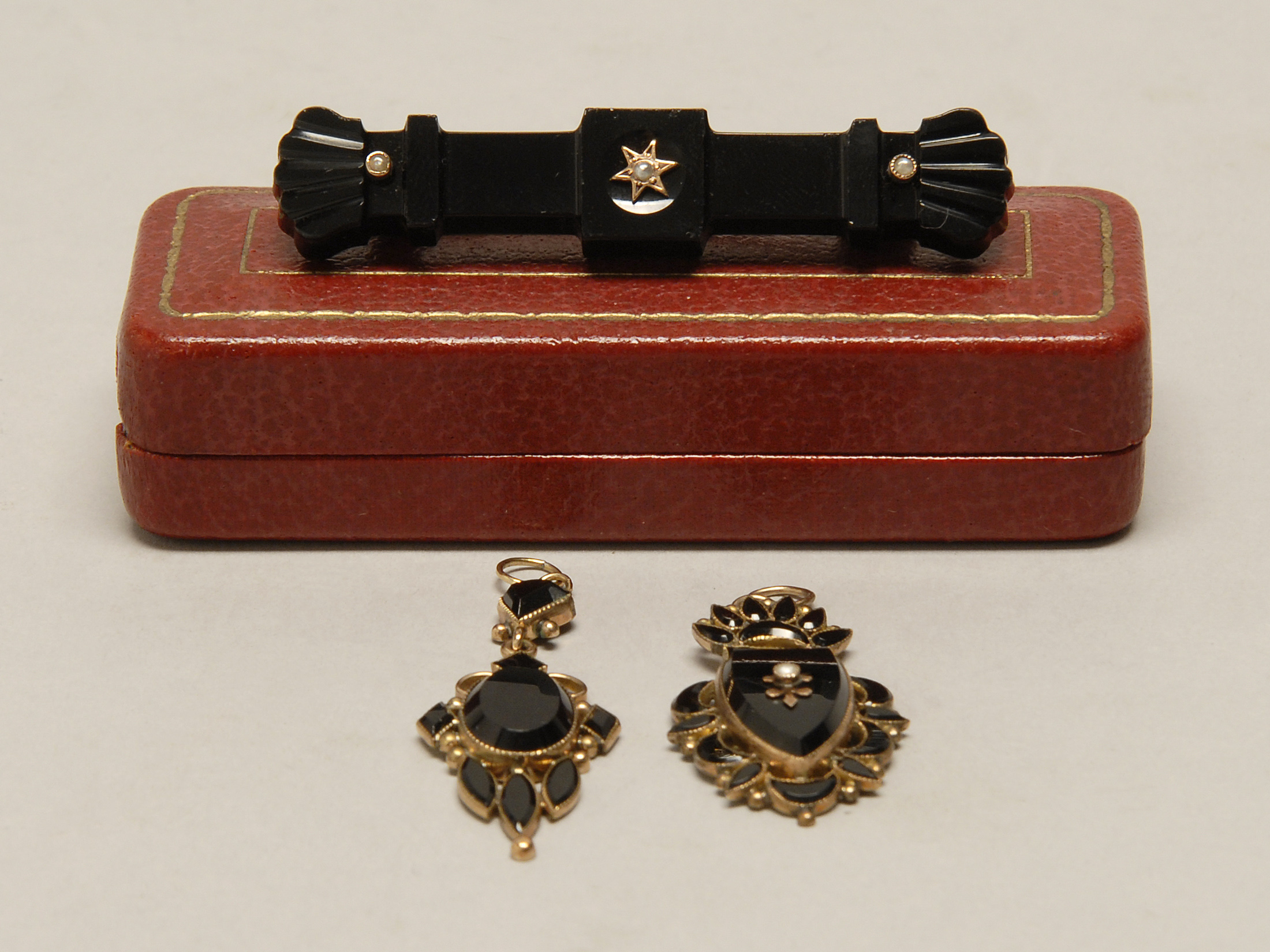 Appraisal: THREE PIECES OF VICTORIAN BLACK ONYX JEWELRY - Two gilt-metal-mounted