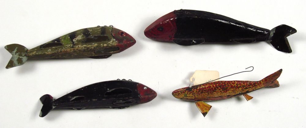 Appraisal: FOUR OLD PAINTED WOODEN FISH DECOYS Lengths to