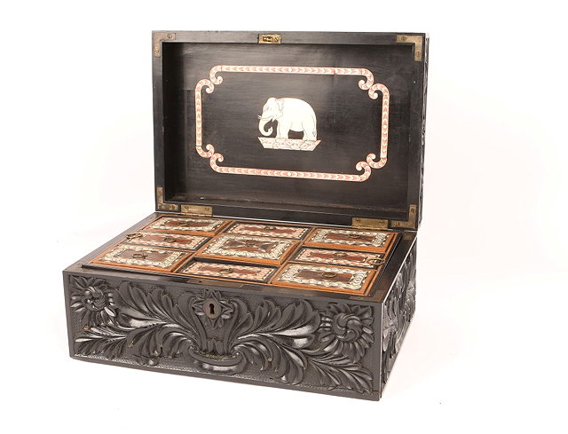 Appraisal: AN ANGLO INDIAN CARVED EBONY SEWING BOX with ivory inlaid