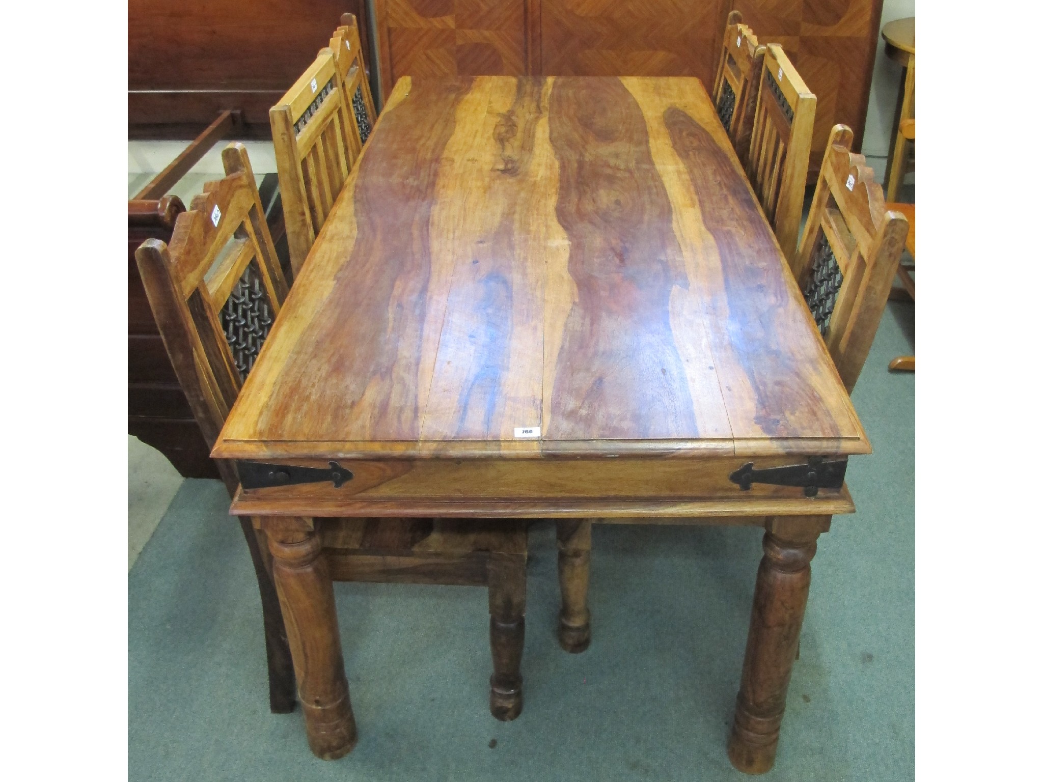 Appraisal: A contemporary teak dining table with two railback and four