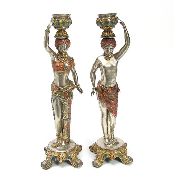 Appraisal: A pair of Italian style silvered polychrome standing blackamoors height