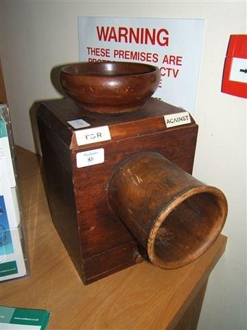 Appraisal: A Victorian mahogany ballot box with later bowl and base