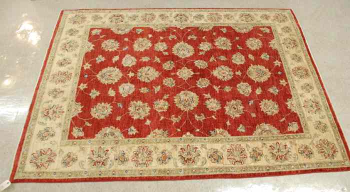 Appraisal: HAND KNOTTED ORIENTAL AREA RUG Pakistani-Persian floral arabesque design on