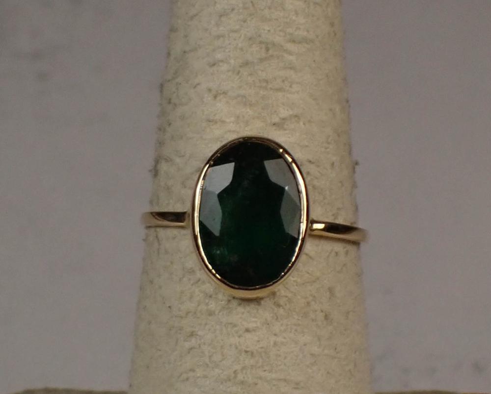 Appraisal: EMERALD AND FOURTEEN KARAT GOLD SOLITAIRE RING The yellow gold