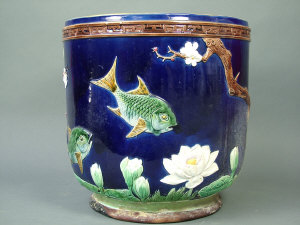 Appraisal: A Joseph Holdcroft Majolica jardiniere c moulded with fish swimming