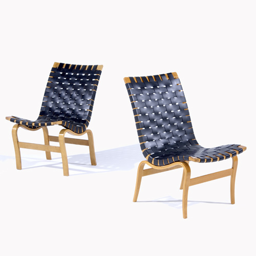 Appraisal: BRUNO MATHSSON Pair of lounge chairs with black leather webbing