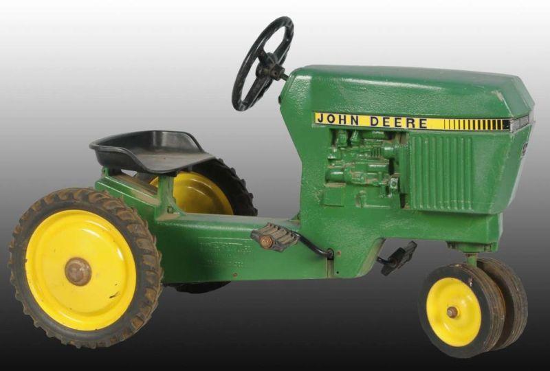 Appraisal: Lot of Cast Metal John Deere Pedal Tractors Description John