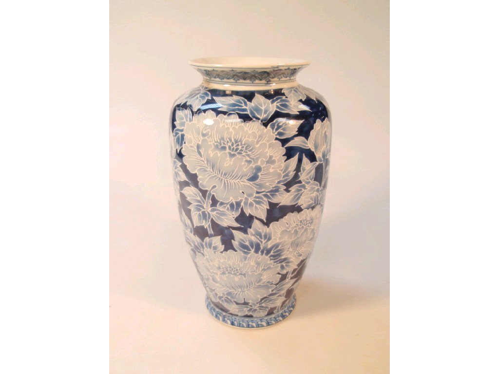 Appraisal: A Japanese blue and white baluster vase highlighted in white