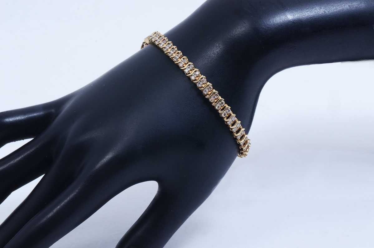 Appraisal: K CTW DIAMOND BRACELET K yellow gold bracelet contains round