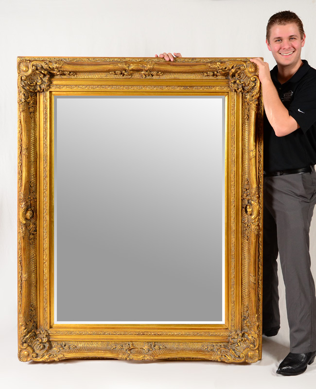 Appraisal: LARGE CARVED GILT WALL MIRROR Deep carved frame beveled glass