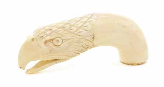 Appraisal: A Carved Walrus Ivory Cane Handle in the form of