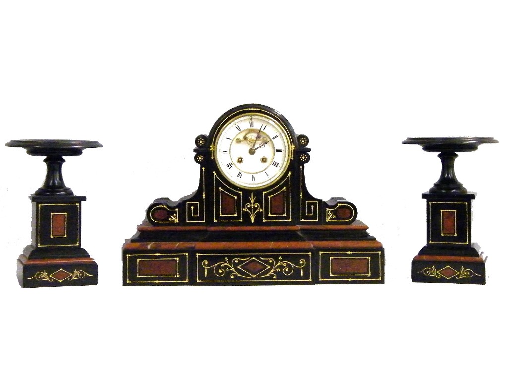 Appraisal: Black slate and red marble two train mantel clock garniture