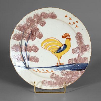 Appraisal: Delft rooster plate standing yellow rooster with sponged manganese tree