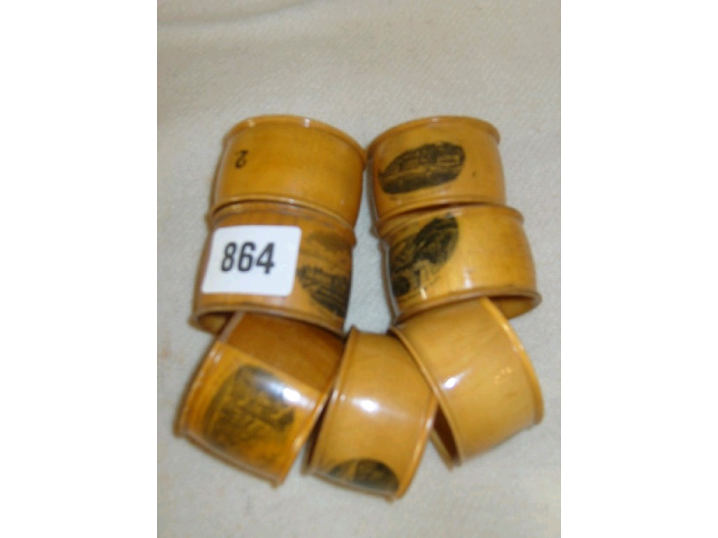 Appraisal: A collection of seven Mauchline ware napkin rings The Terrace