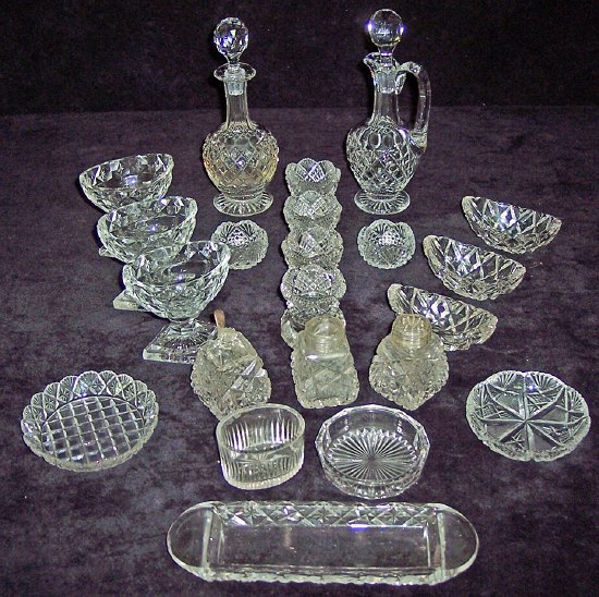 Appraisal: Three oval cut glass salt cellars on diamond shaped lemon