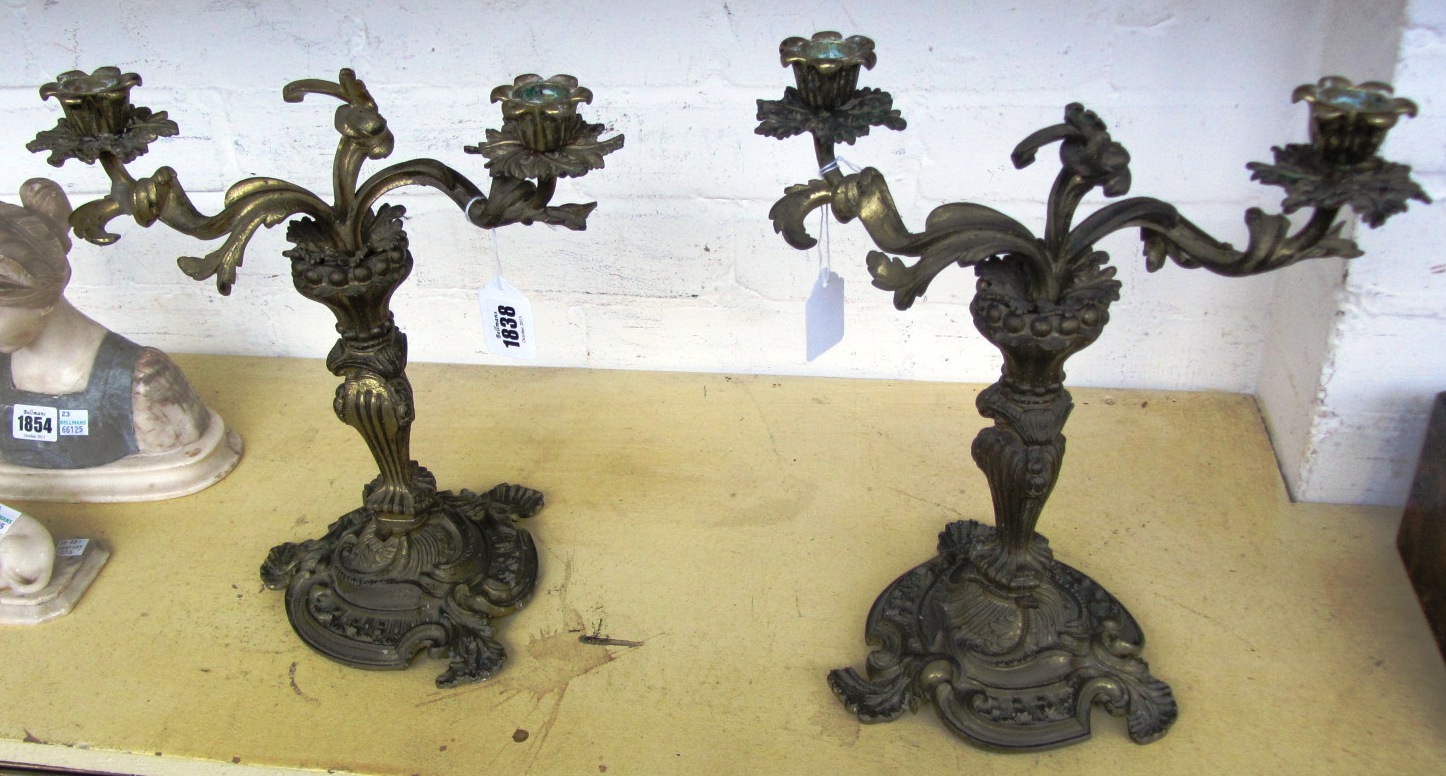 Appraisal: A pair of bronze rococo style two branch candelabra of