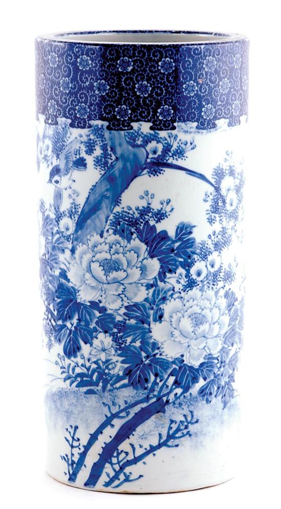 Appraisal: Unusual Chinese blue-and-white umbrella stand circa traditional birds amongst peony