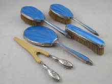 Appraisal: A blue guilloche enamelled silver dressing table set of three