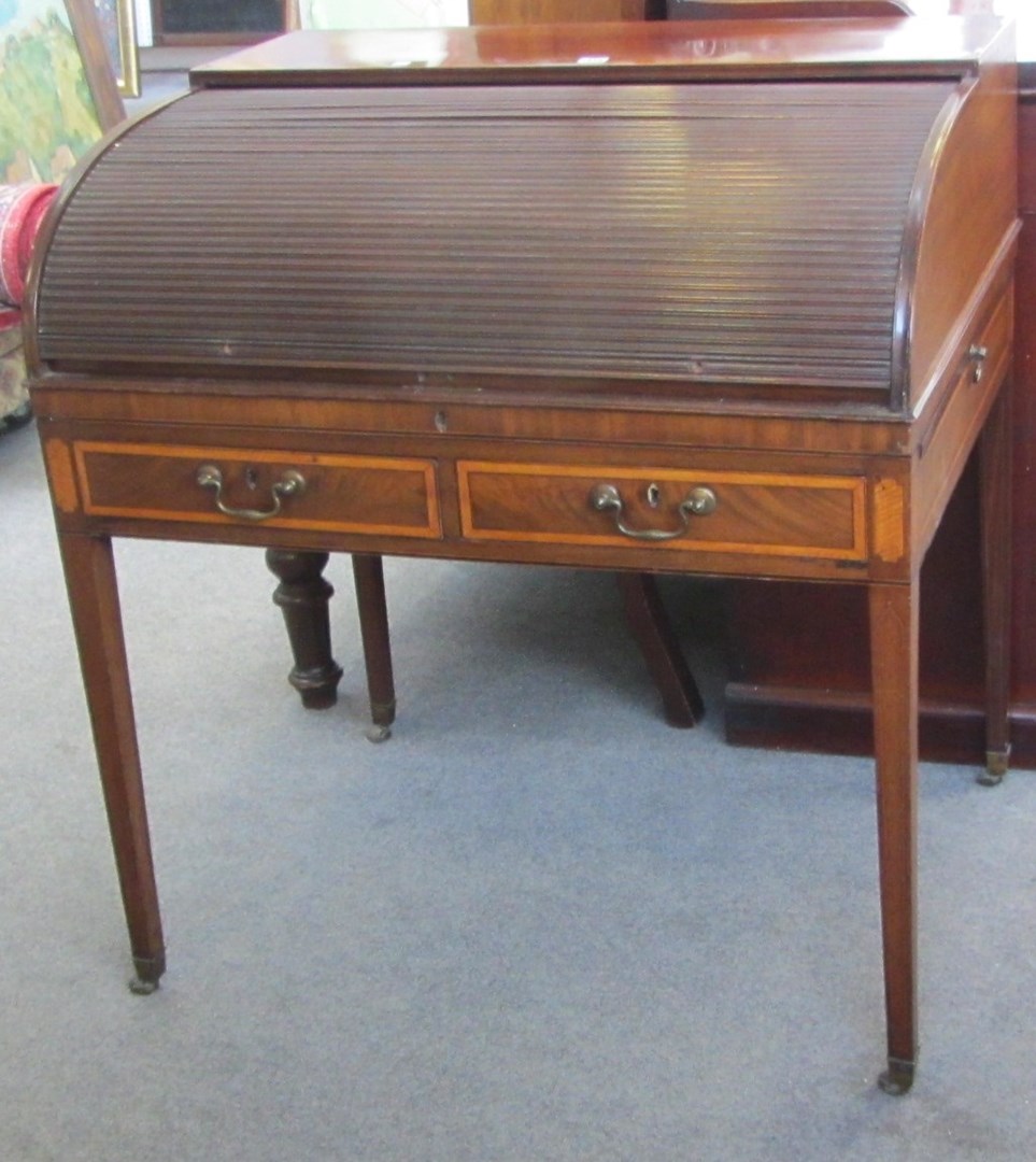 Appraisal: A George III satinwood banded mahogany tambour front desk on