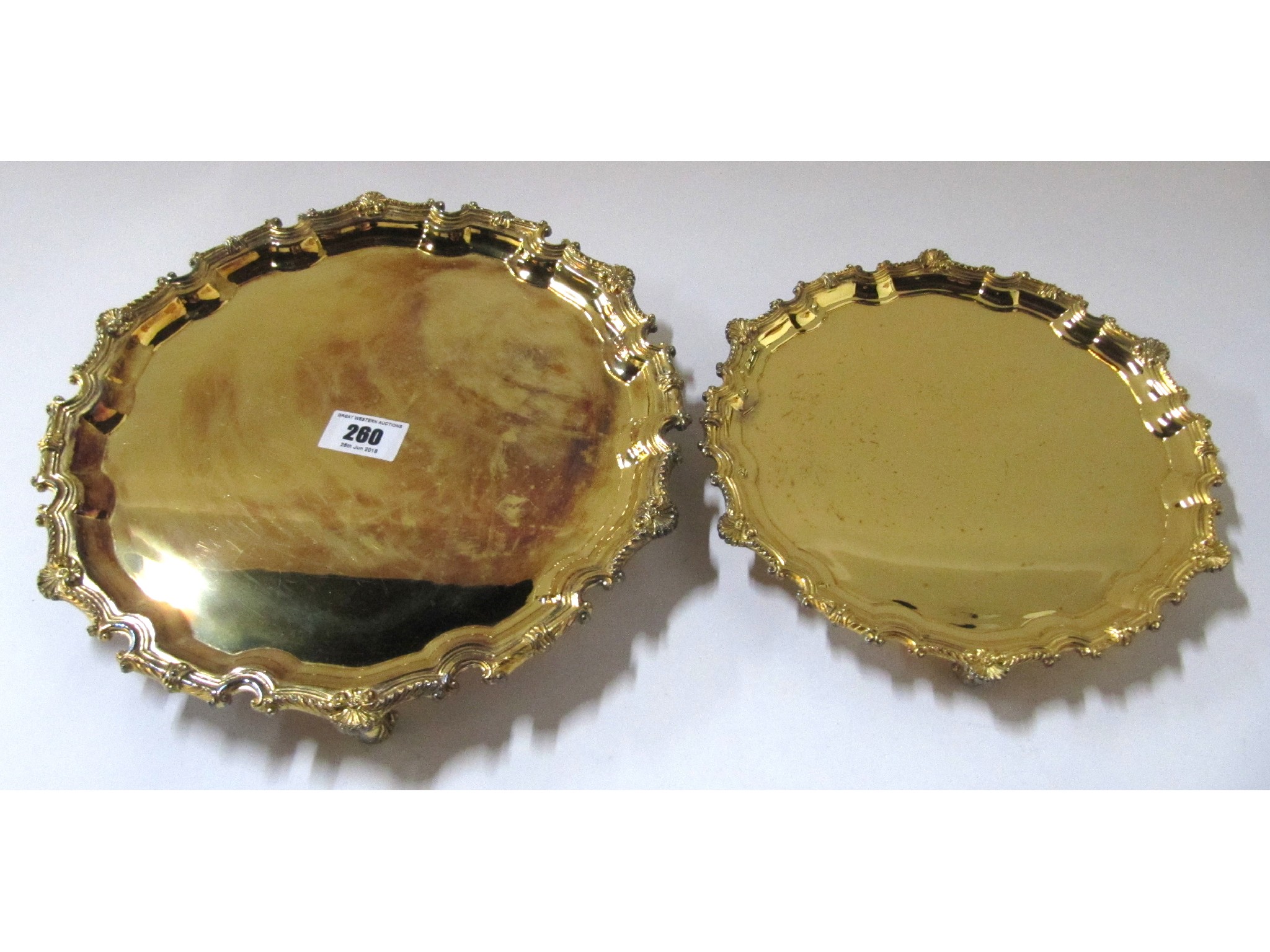 Appraisal: A graduated pair of silver gilt salvers London oz