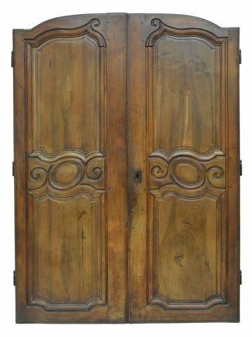 Appraisal: French Provincial walnut architectural armoire doors th c now joined