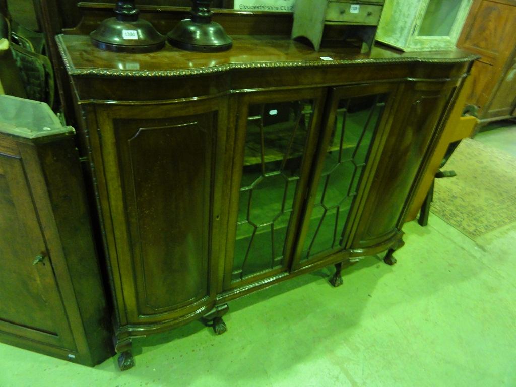 Appraisal: An Edwardian mahogany display cabinet partially enclosed by a pair