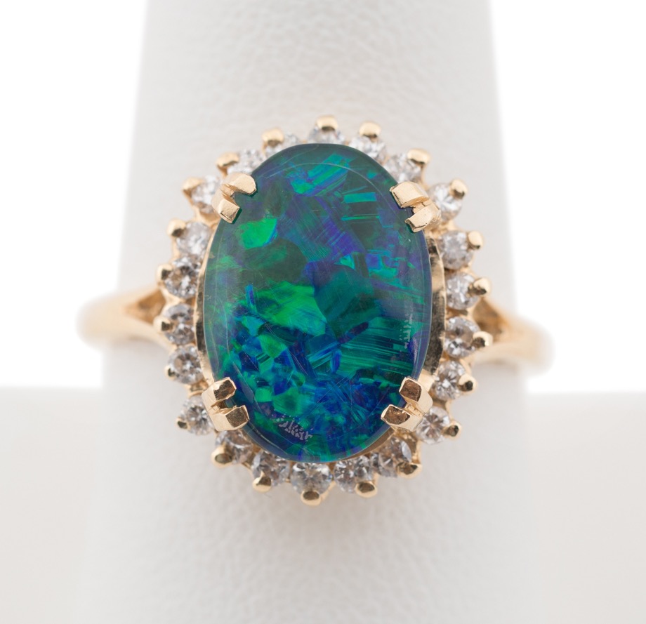 Appraisal: K YG OPAL QUADPLET DIAMOND RING k yellow gold opal