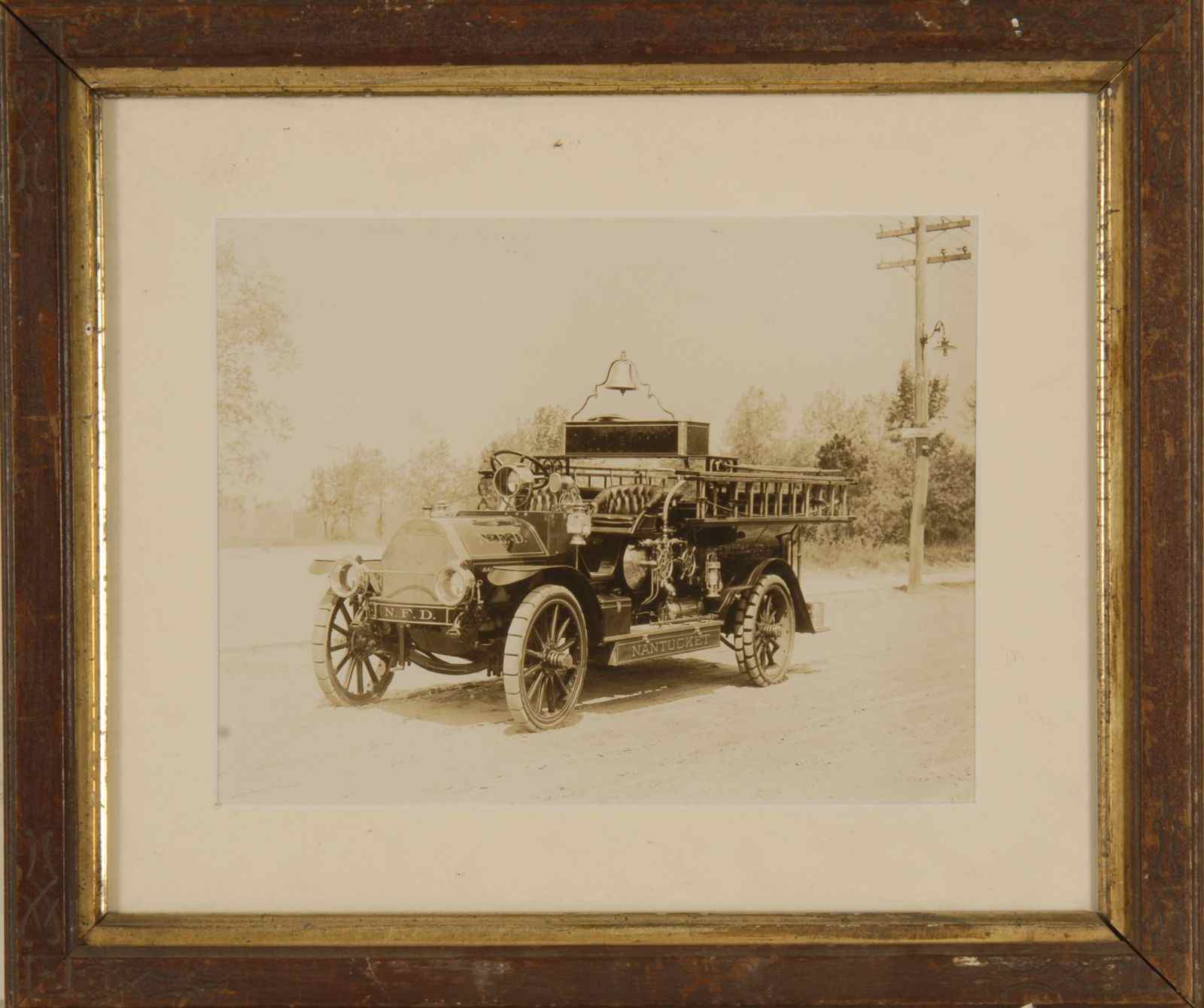 Appraisal: FRAMED BLACK AND WHITE PHOTOGRAPH OF A NANTUCKET HOOK LADDER