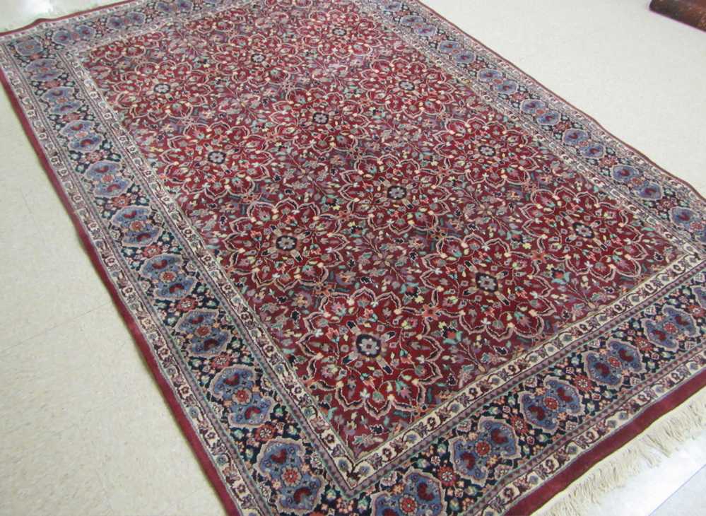 Appraisal: HAND KNOTTED ORIENTAL CARPET Indo-Persian overall floral and multiple floral