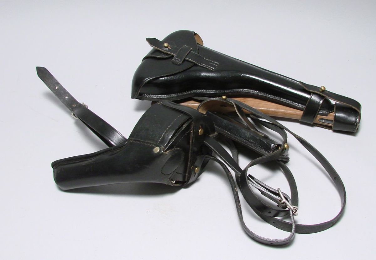 Appraisal: REPRODUCTION HOLSTER With snail drum and tools