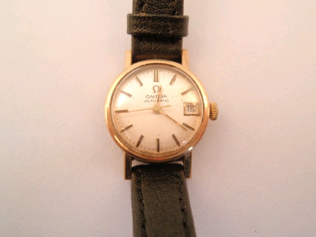 Appraisal: A ladies Omega wristwatch automatic gold case round dial with