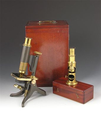 Appraisal: A brass and patinated microscope with a draw tube and