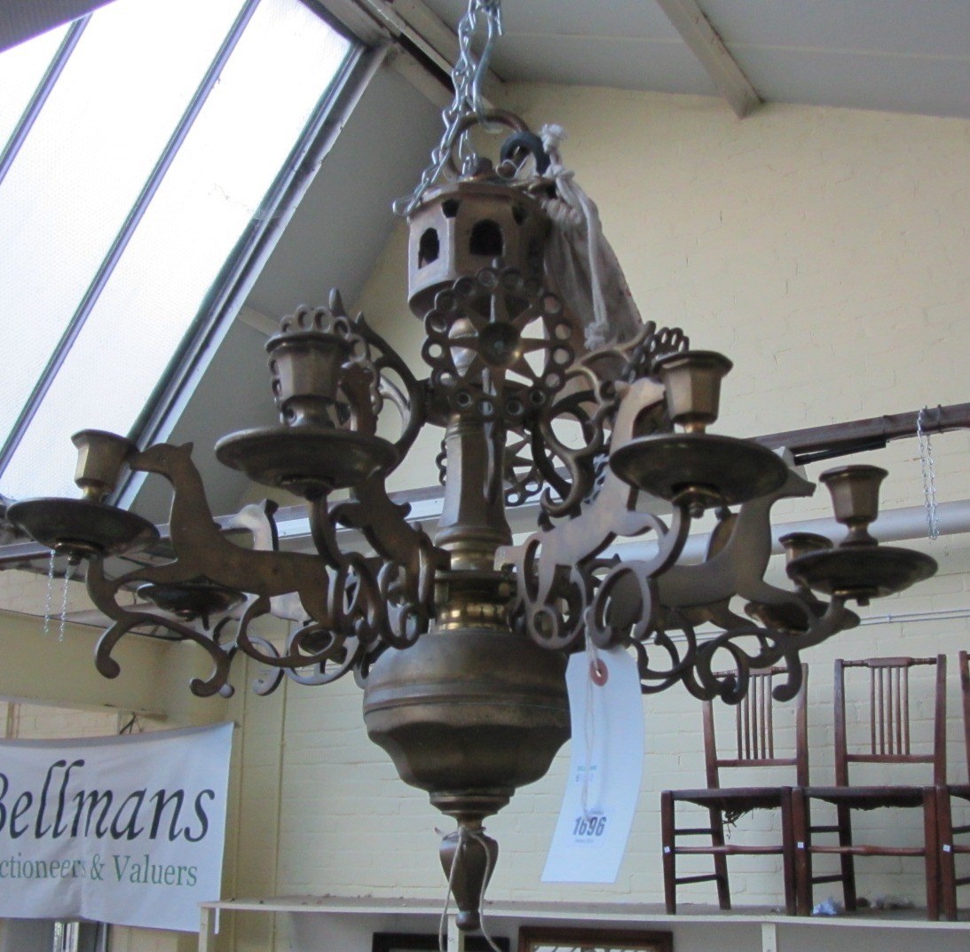 Appraisal: A German brass eight light chandelier the faceted and turned