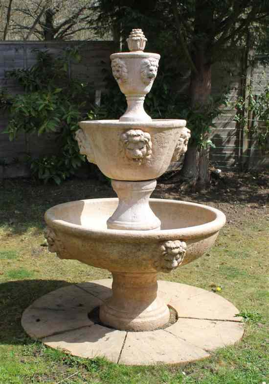 Appraisal: A simulated marble three tier garden fountain with urn surmount