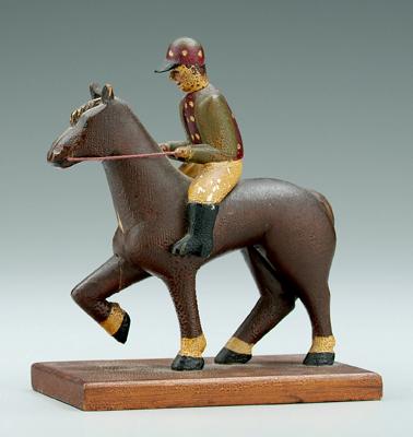 Appraisal: Carved jockey and horse carved and painted wood - in