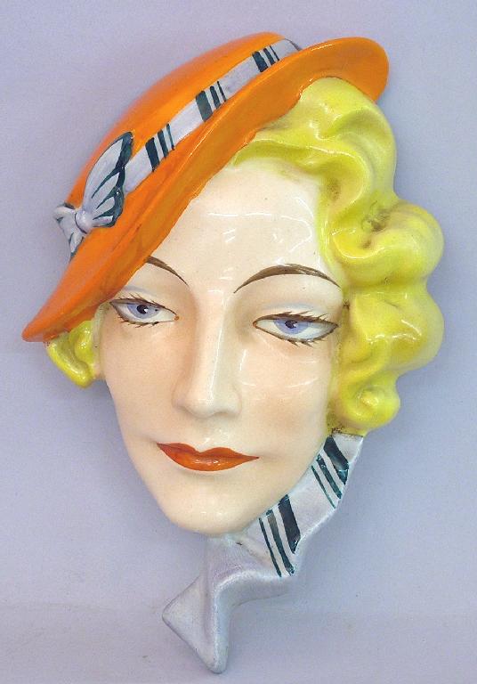 Appraisal: Continental 's pottery face mask modelled as a blonde lady