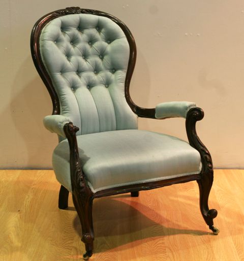 Appraisal: A Victorian walnut and upholstered armchair